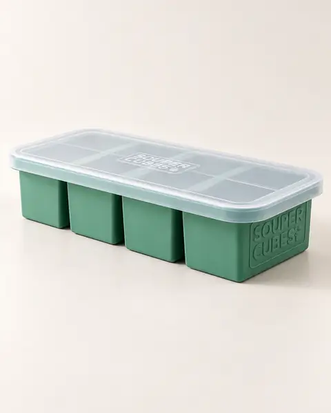 Green Souper Cubes tray with its clear lid on